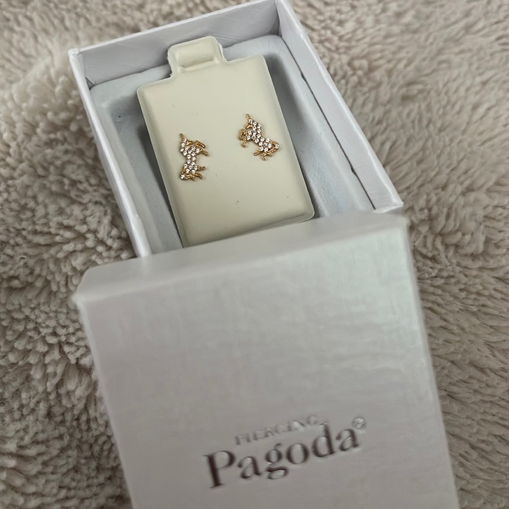 Brand new , 10 k yellow gold unicorn earrings